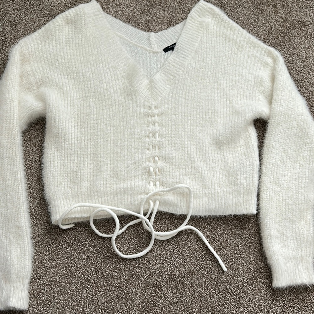 white fuzzy sweater